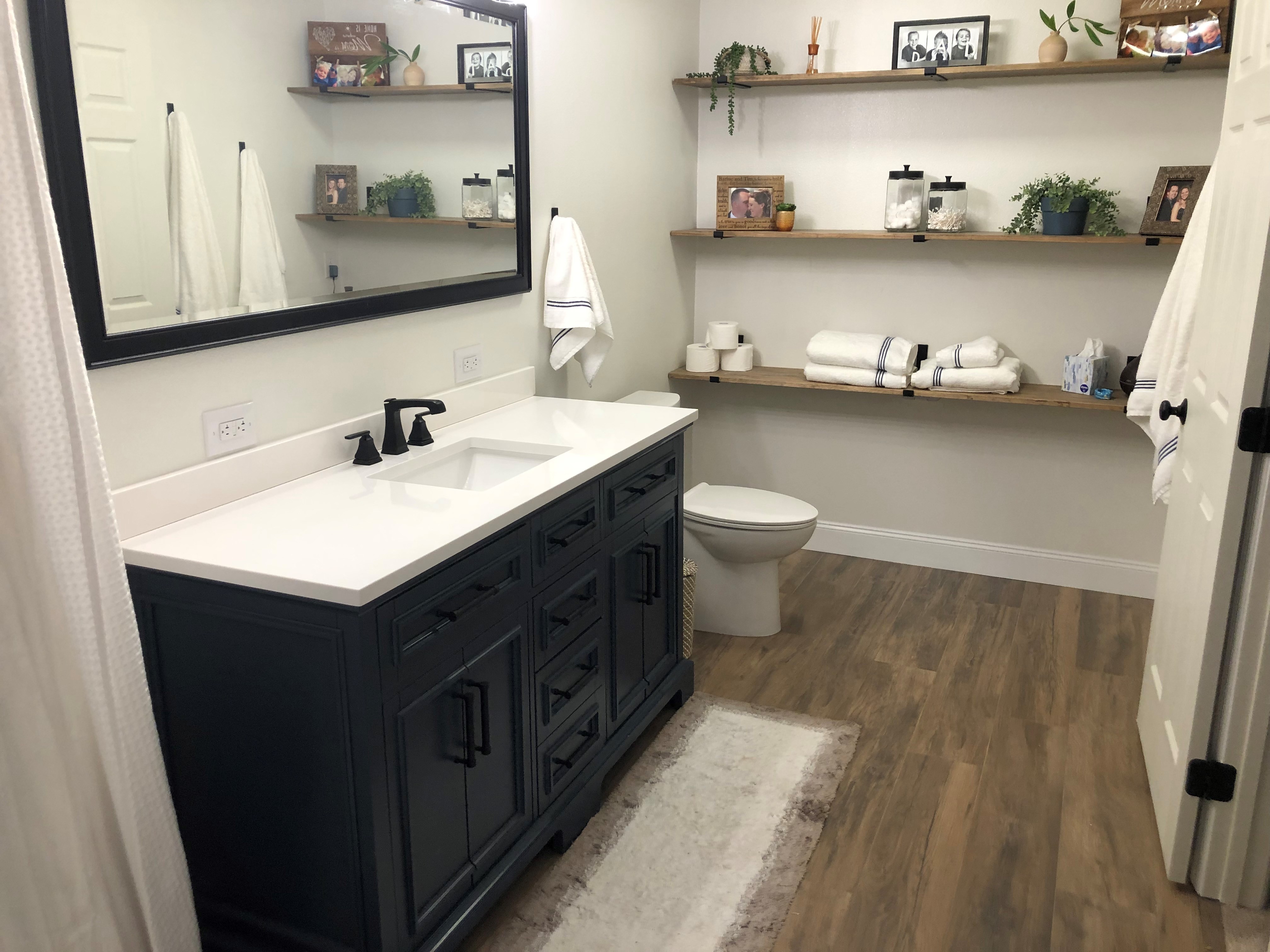 Finished Master Bathroom - 
		The handmade shelves I built specially for this space and stained to blend with the tile floors.